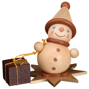 Wichtel auf Stern mit Geschenk